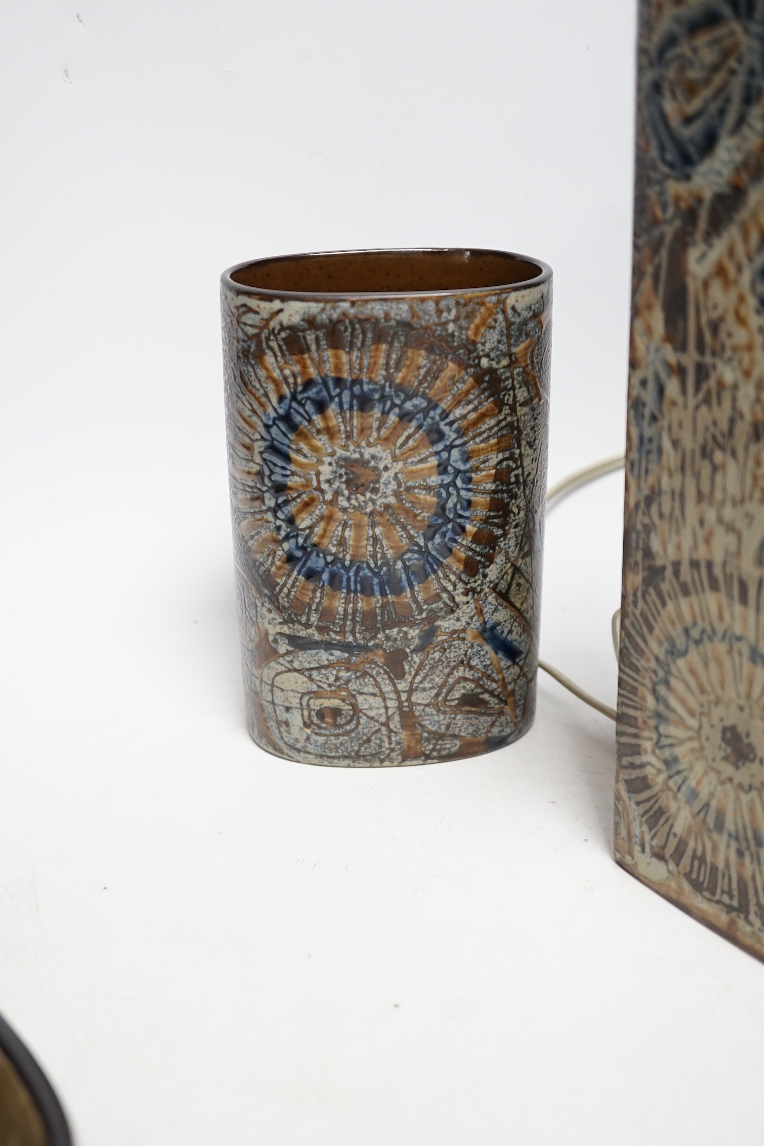 Five Royal Copenhagen fajance items; a lamp, two vases, and two shallow dishes, tallest 29cm